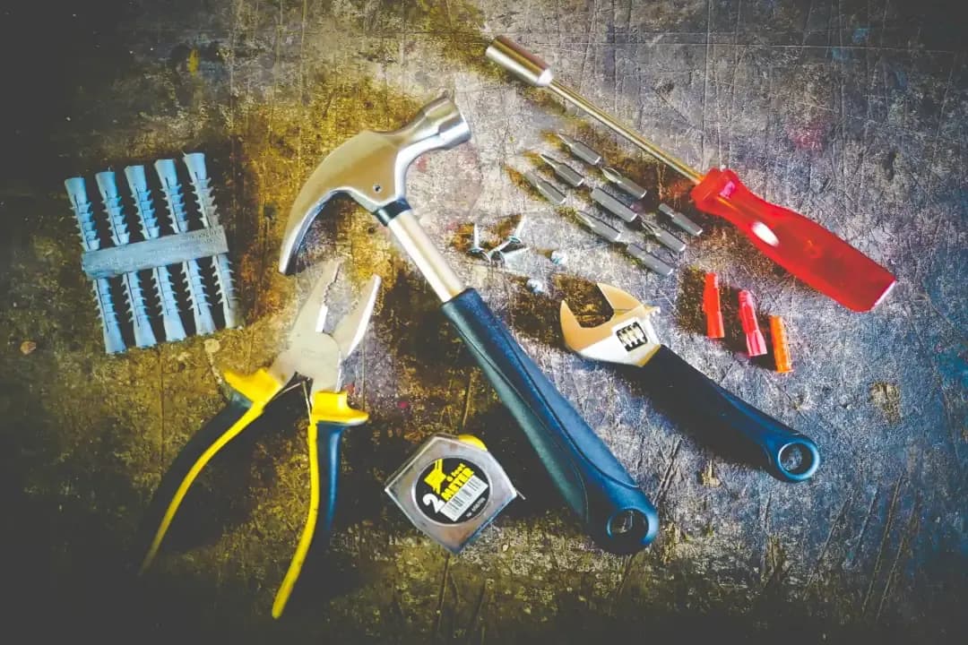 An assortment of tools on a table in a circle.