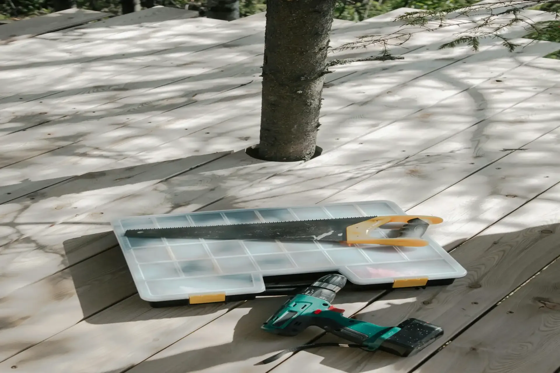 A deck with tools on the porch.