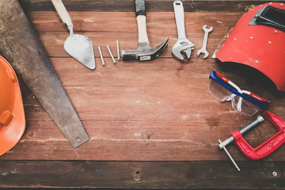 An assortment of tools on a table in a circle.